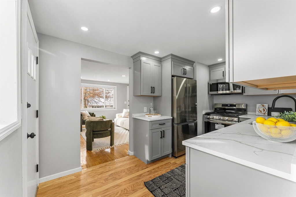 10 Van Brunt Street Boston, MA 02136 - Photo 6 of 31 a kitchen with a sink appliances and cabinets