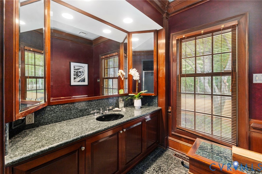 2125 Strawberry Run Crozier, VA 23039 - Photo 23 of 50 a bathroom with a granite countertop sink and a large mirror