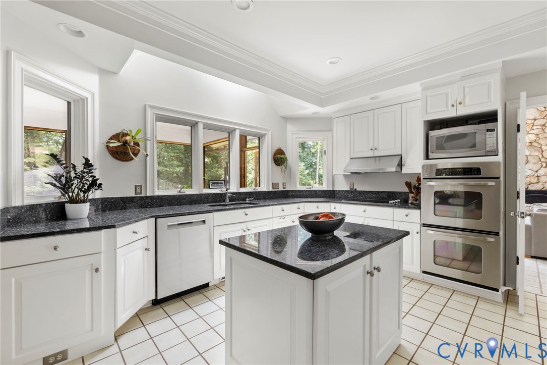 2125 Strawberry Run Crozier, VA 23039 - Photo 27 of 50 a kitchen with stainless steel appliances a sink stove and microwave