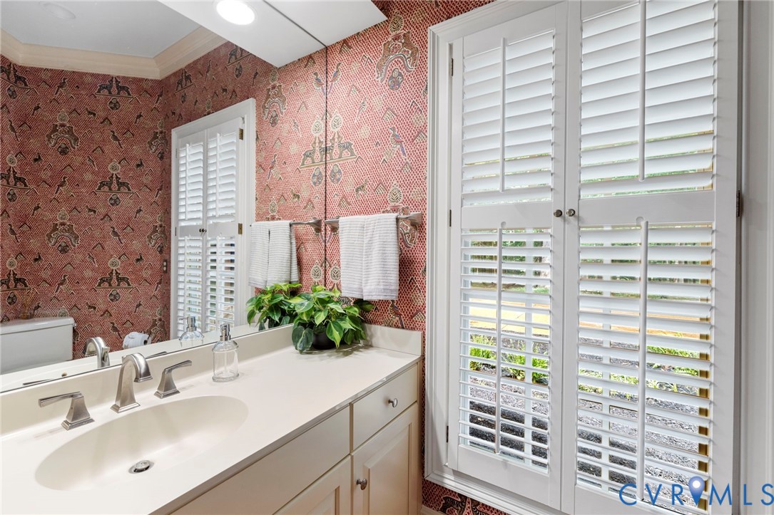 2125 Strawberry Run Crozier, VA 23039 - Photo 31 of 50 a bathroom with a sink and a large mirror