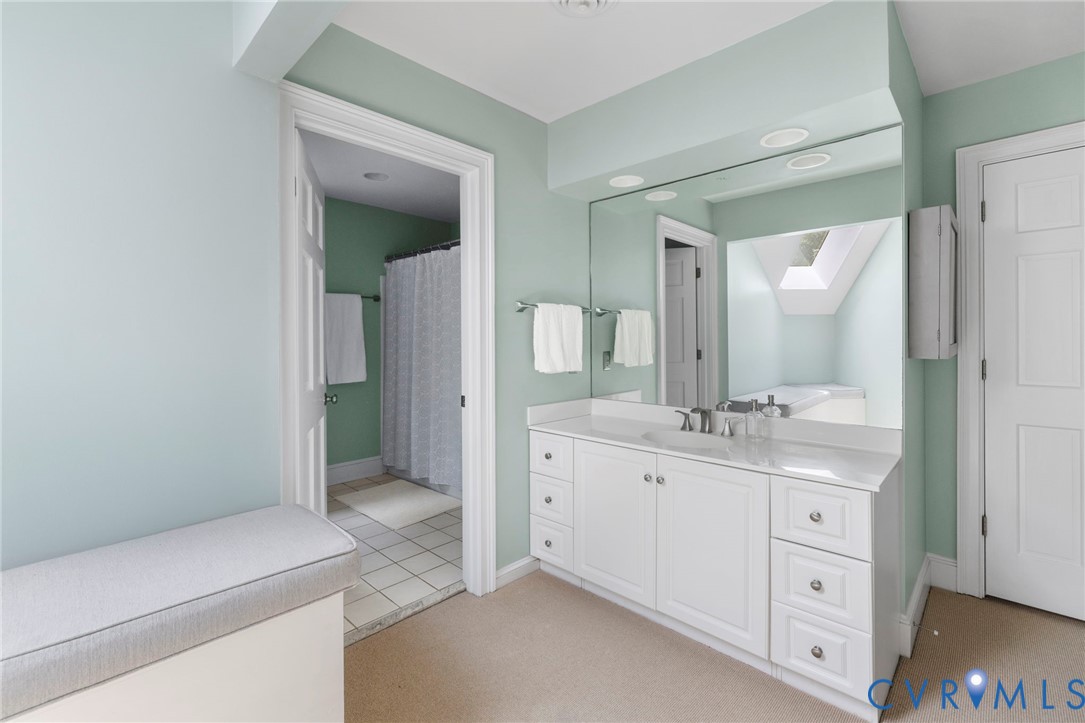 2125 Strawberry Run Crozier, VA 23039 - Photo 34 of 50 a spacious bathroom with a granite countertop sink and a mirror