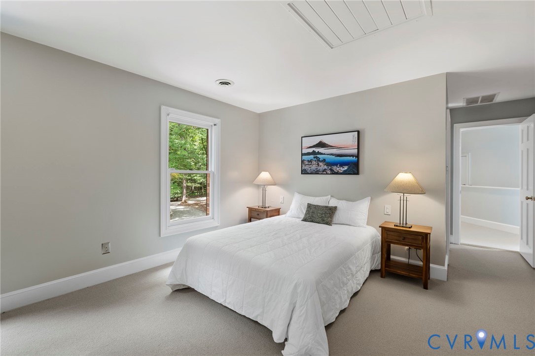 2125 Strawberry Run Crozier, VA 23039 - Photo 37 of 50 a bedroom with a bed and a lamp