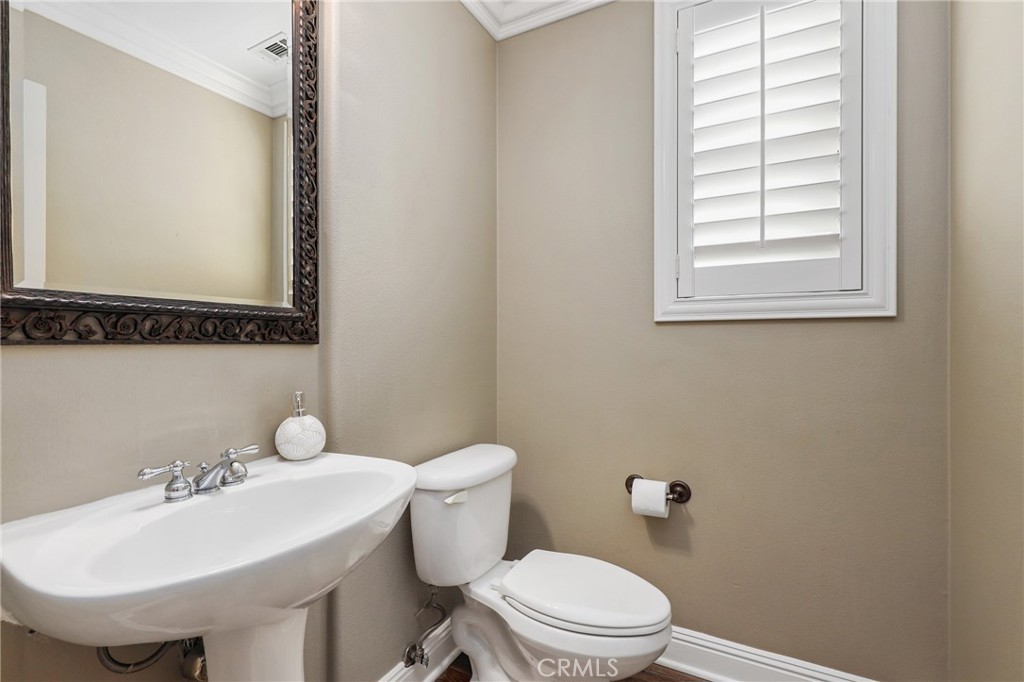 12 Globe Lane Ladera Ranch, CA 92694 - Photo 17 of 37 a bathroom with a sink a toilet and mirror