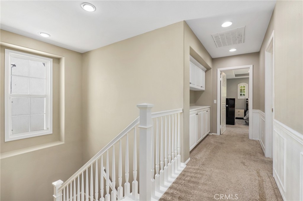 12 Globe Lane Ladera Ranch, CA 92694 - Photo 18 of 37 a view of a hallway with wooden floor