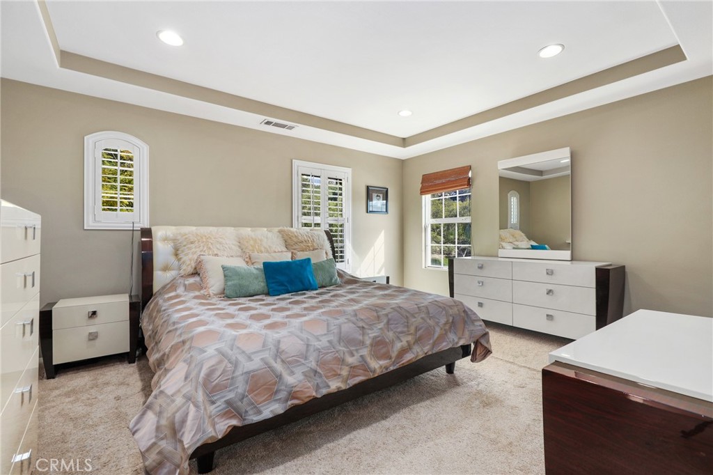 12 Globe Lane Ladera Ranch, CA 92694 - Photo 19 of 37 a bedroom with a bed and a dresser