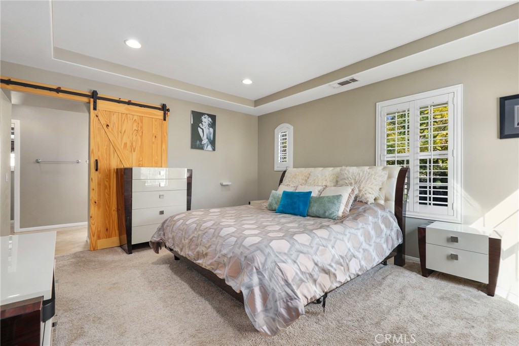 12 Globe Lane Ladera Ranch, CA 92694 - Photo 20 of 37 a bedroom with a bed and a window