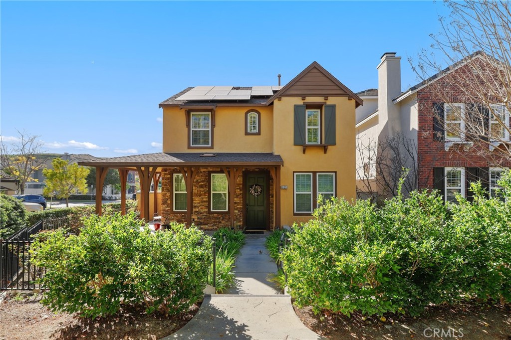 12 Globe Lane Ladera Ranch, CA 92694 - Photo 2 of 37 a front view of a house with garden