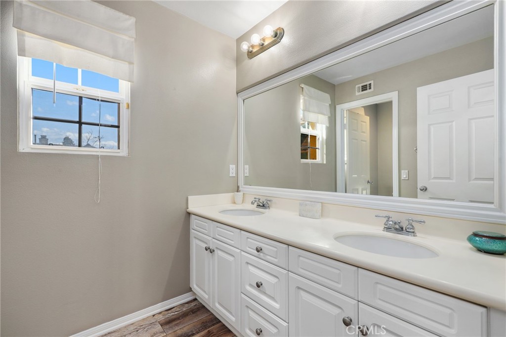 12 Globe Lane Ladera Ranch, CA 92694 - Photo 25 of 37 a bathroom with a sink and a mirror