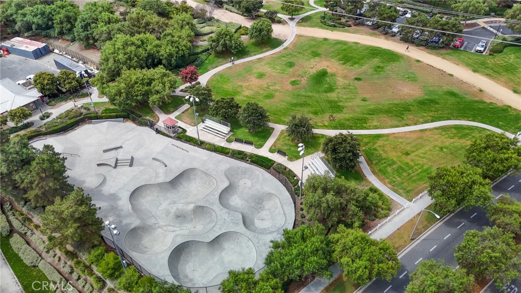 12 Globe Lane Ladera Ranch, CA 92694 - Photo 36 of 37 an aerial view of a swimming pool with a yard and outdoor seating