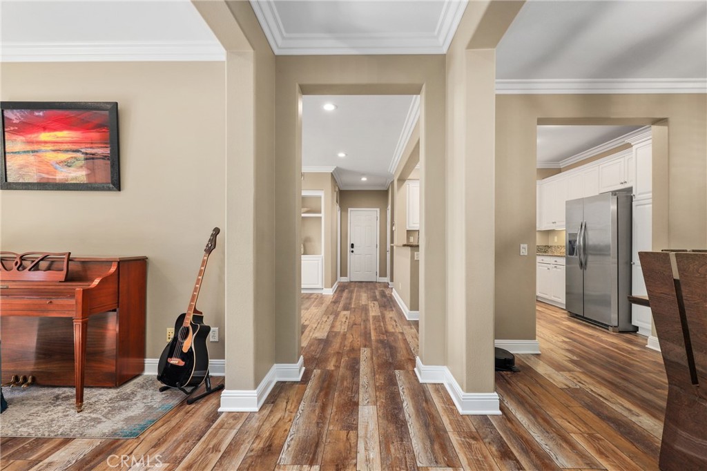 12 Globe Lane Ladera Ranch, CA 92694 - Photo 5 of 37 a view of a hallway with wooden floor and furniture