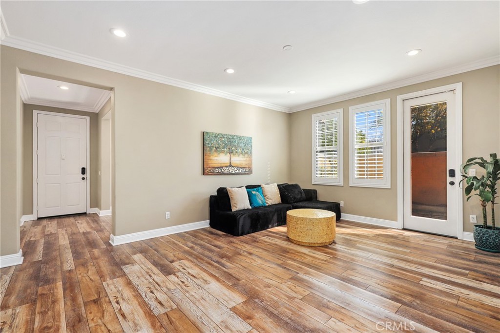 12 Globe Lane Ladera Ranch, CA 92694 - Photo 9 of 37 a bedroom with a bed and wooden floor