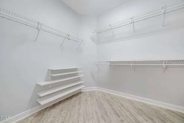 a view of an empty walk in closet