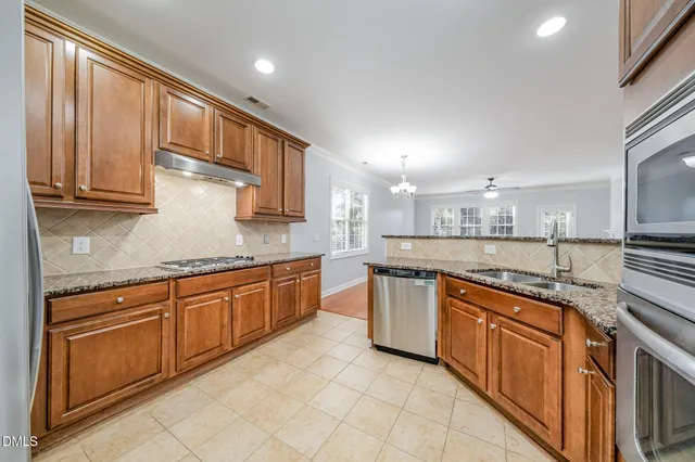 a large kitchen with granite countertop lots of counter top space