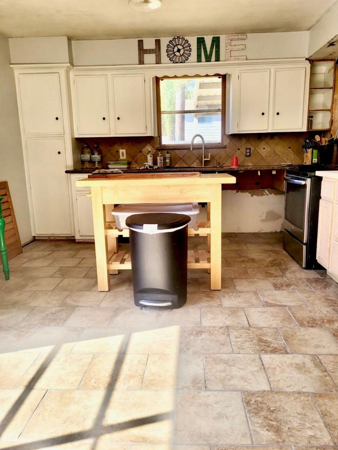 10211 Kerr Lane Conroe, TX 77385 - Photo 12 of 25 a kitchen with stainless steel appliances a stove a sink and a refrigerator