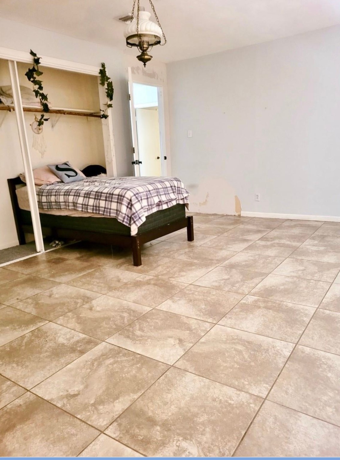 10211 Kerr Lane Conroe, TX 77385 - Photo 16 of 25 a bedroom with a bed a rug and wooden floor