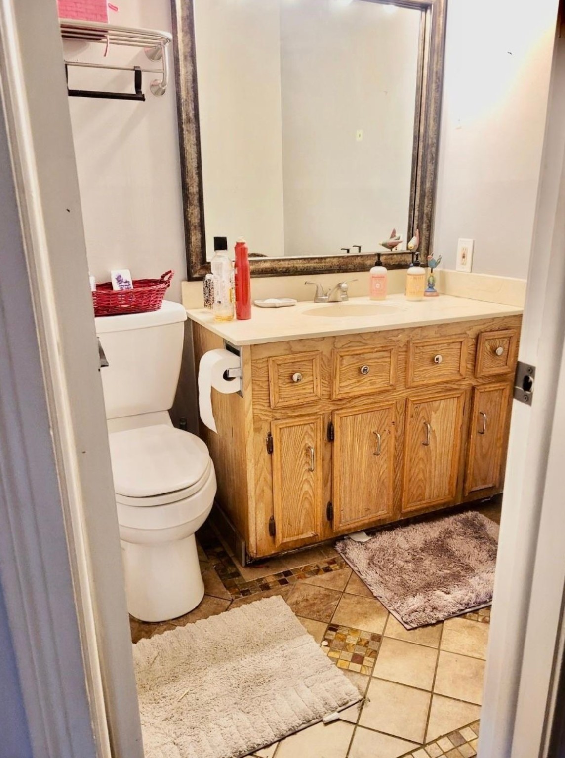 10211 Kerr Lane Conroe, TX 77385 - Photo 22 of 25 a bathroom with a toilet sink and mirror