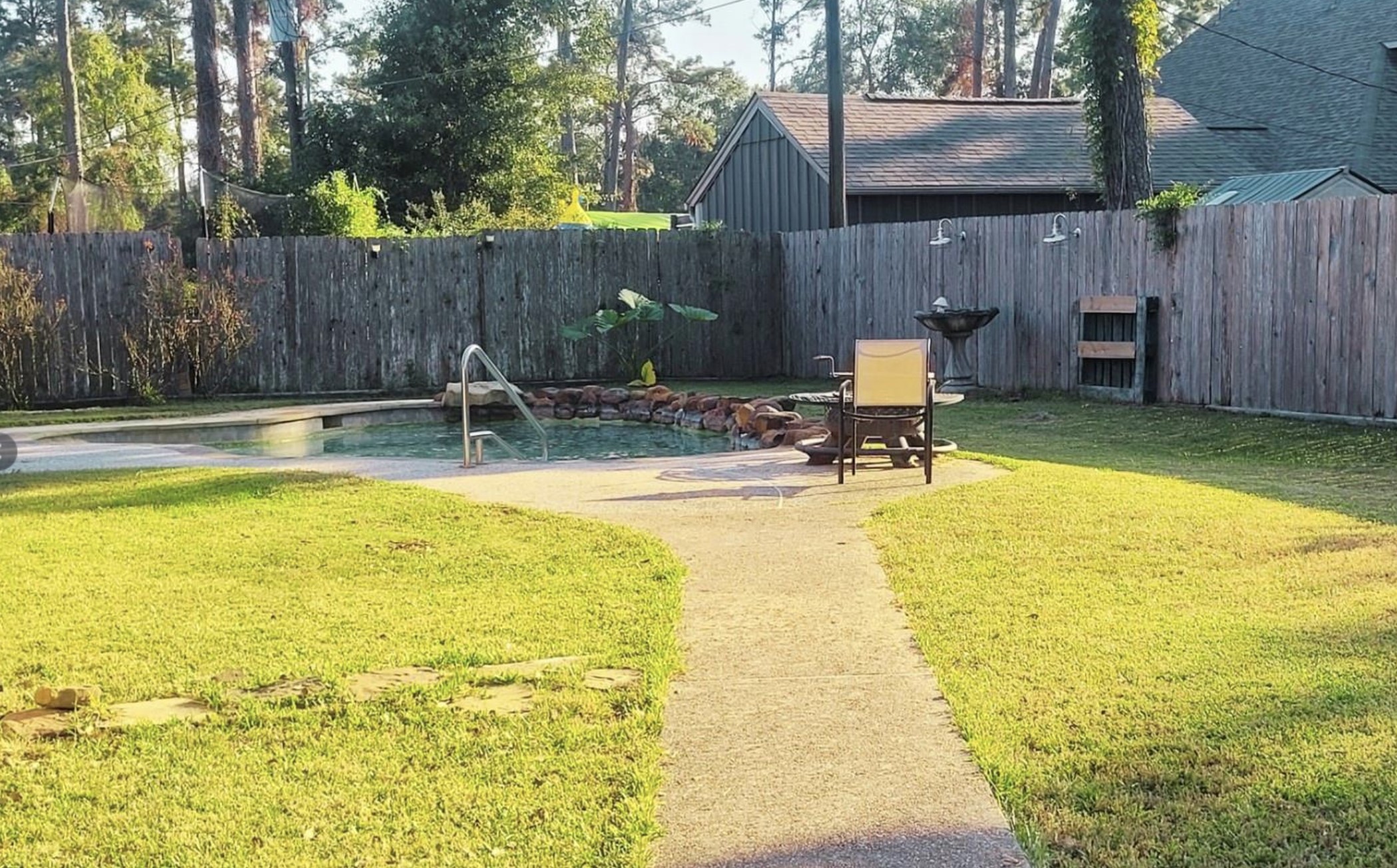 10211 Kerr Lane Conroe, TX 77385 - Photo 5 of 25 a view of a swimming pool with a patio