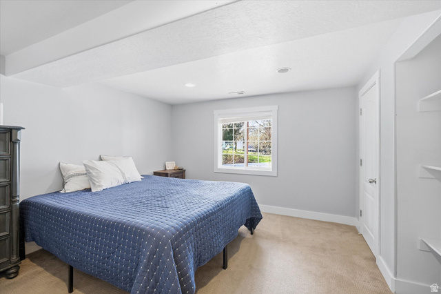 353 Robin Street Smithfield, UT 84335 - Photo 37 of 70 Bedroom with light colored carpet and recessed lighting
