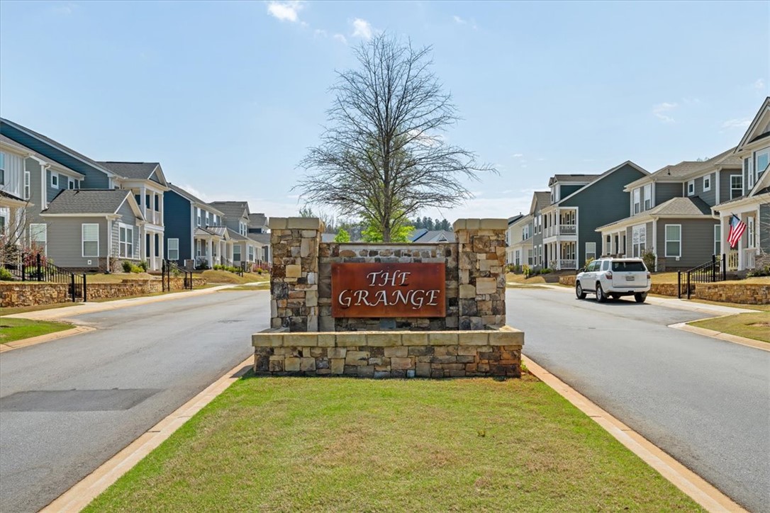 215 Founders Boulevard Central, SC 29630 - Photo 15 of 50 Welcome to this charming community, where modern homes line a peaceful street with well-maintained landscaping.