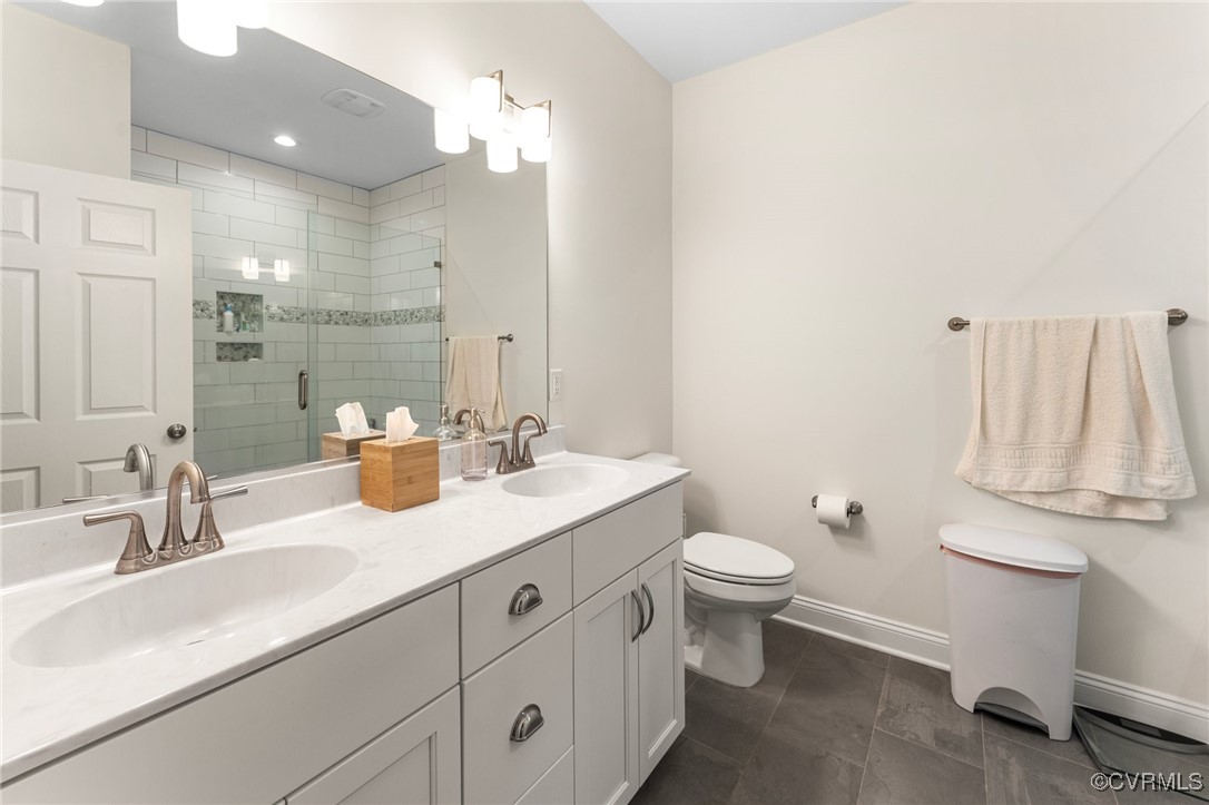 216 Edwin Circle Aylett, VA 23009 - Photo 20 of 27 a bathroom with a sink a toilet and a mirror