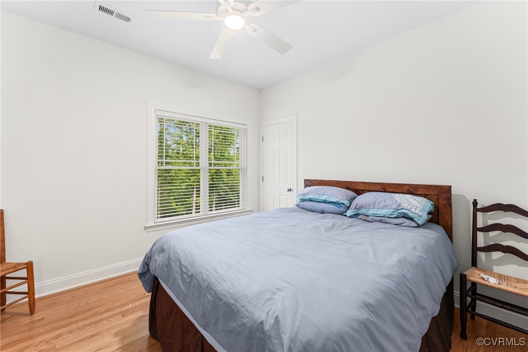 216 Edwin Circle Aylett, VA 23009 - Photo 24 of 27 a large bed sitting in a bedroom next to a window