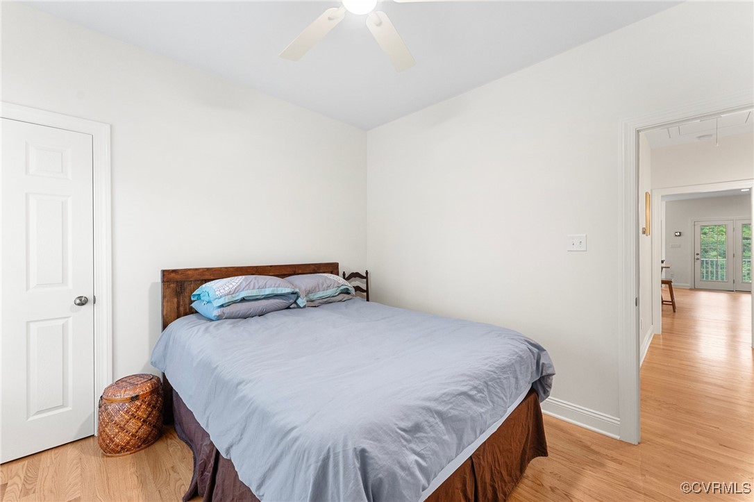216 Edwin Circle Aylett, VA 23009 - Photo 25 of 27 a bedroom with a bed and wooden floor