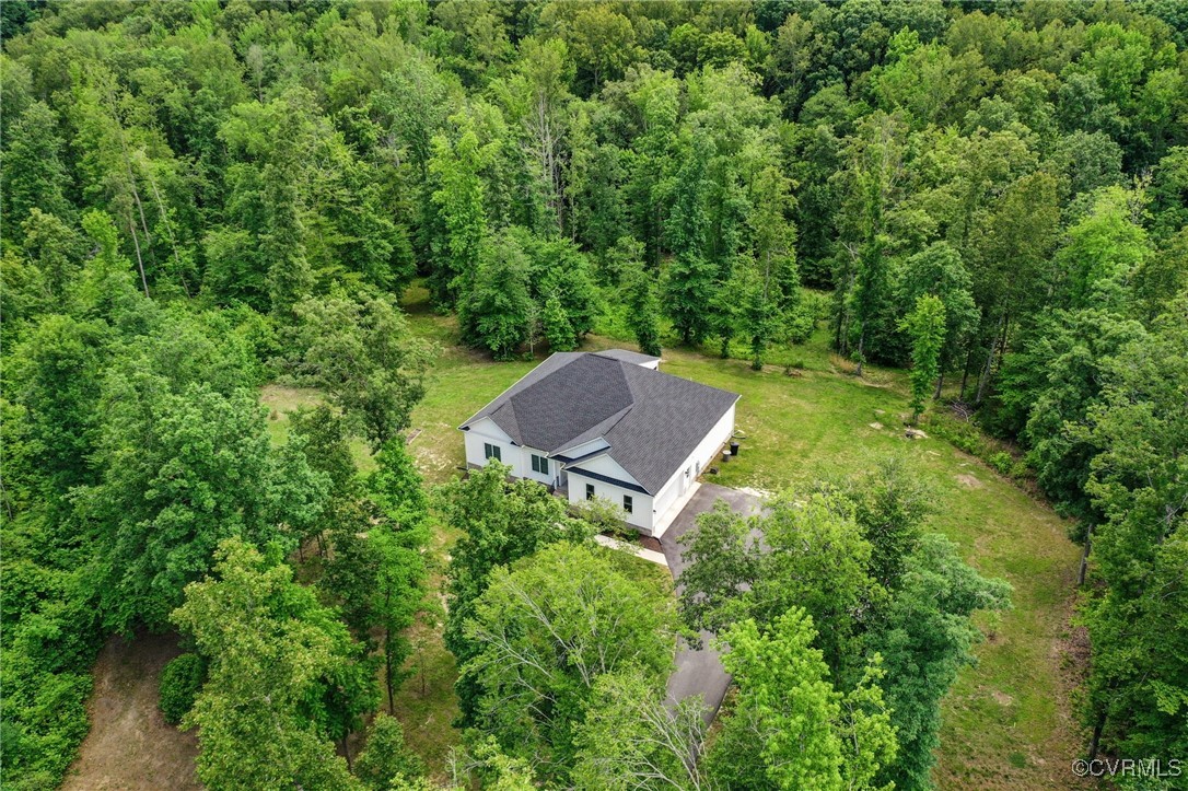 216 Edwin Circle Aylett, VA 23009 - Photo 3 of 27 a backyard of a house with a yard and outdoor seating