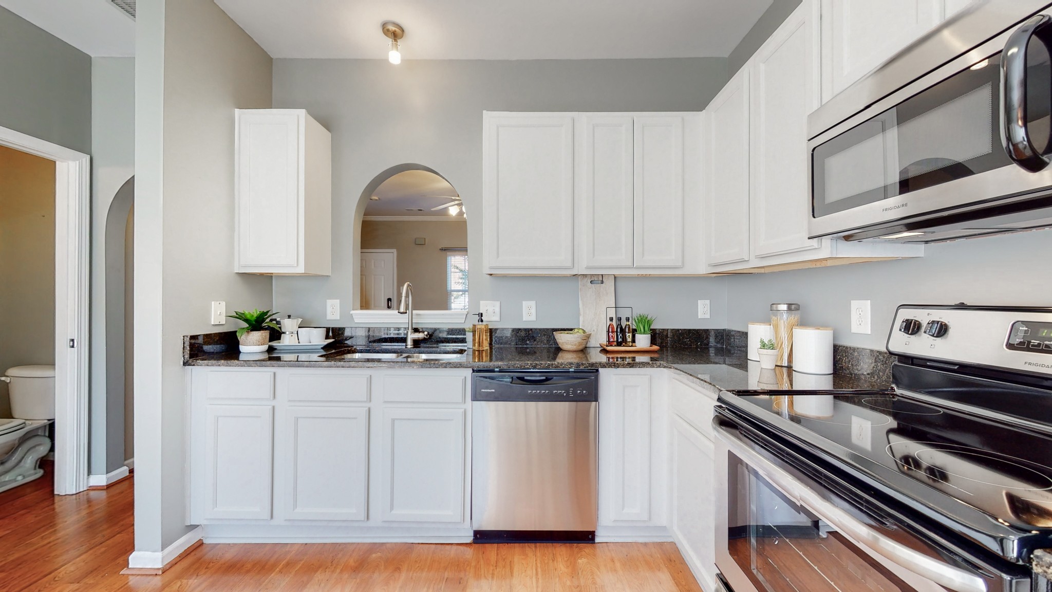 1101 Downs Boulevard, Unit 93 Franklin, TN 37064 - Photo 9 of 38 a kitchen with stainless steel appliances granite countertop a stove and a refrigerator
