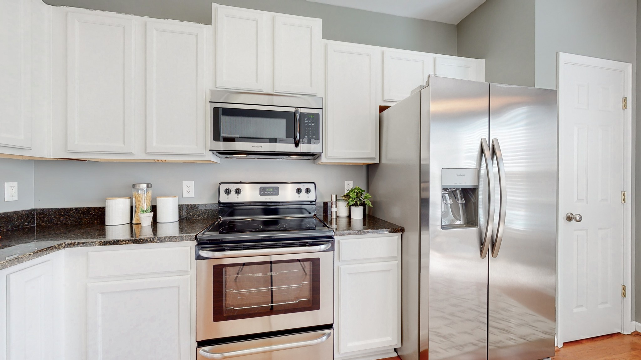 1101 Downs Boulevard, Unit 93 Franklin, TN 37064 - Photo 10 of 38 a kitchen with stainless steel appliances granite countertop a refrigerator a stove a microwave and cabinets
