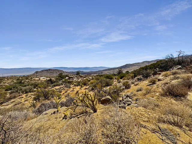 a view of a city with mountains in the background