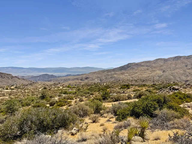 a view of a city with mountains in the background