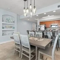 a view of kitchen island with granite countertop cabinets