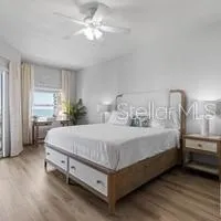 a large white bed in a white room