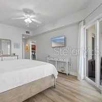 a large white bed in a white room