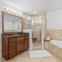a bathroom with a bathtub and shower