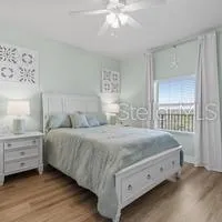 a view of an empty room with a chandelier