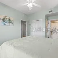 a bathroom with a granite countertop sink a toilet and a mirror