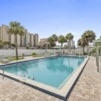 a view of swimming pool with outdoor seating and city view
