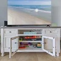 a view of kitchen with furniture and a fireplace