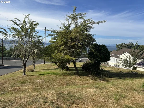 a swimming pool with an outdoor space and seating area