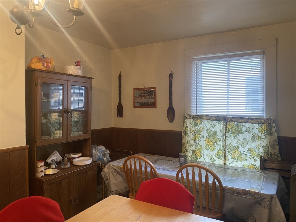 25 West Baltimore Street Lynn, MA 01902 - Photo 8 of 15 a living room with furniture fireplace and large windows