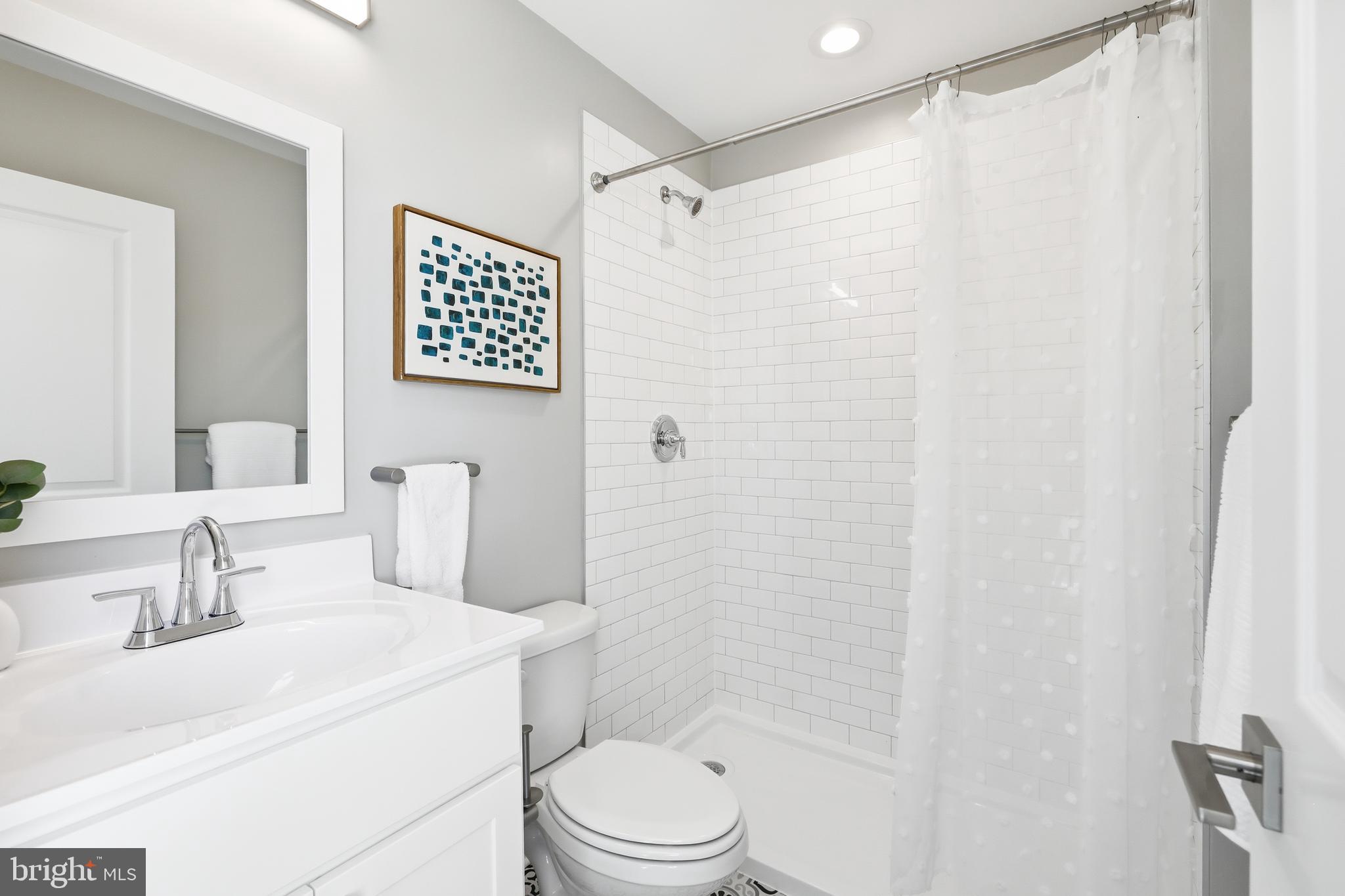 703 East Preston Street Baltimore, MD 21202 - Photo 11 of 26 a bathroom with a sink toilet and shower
