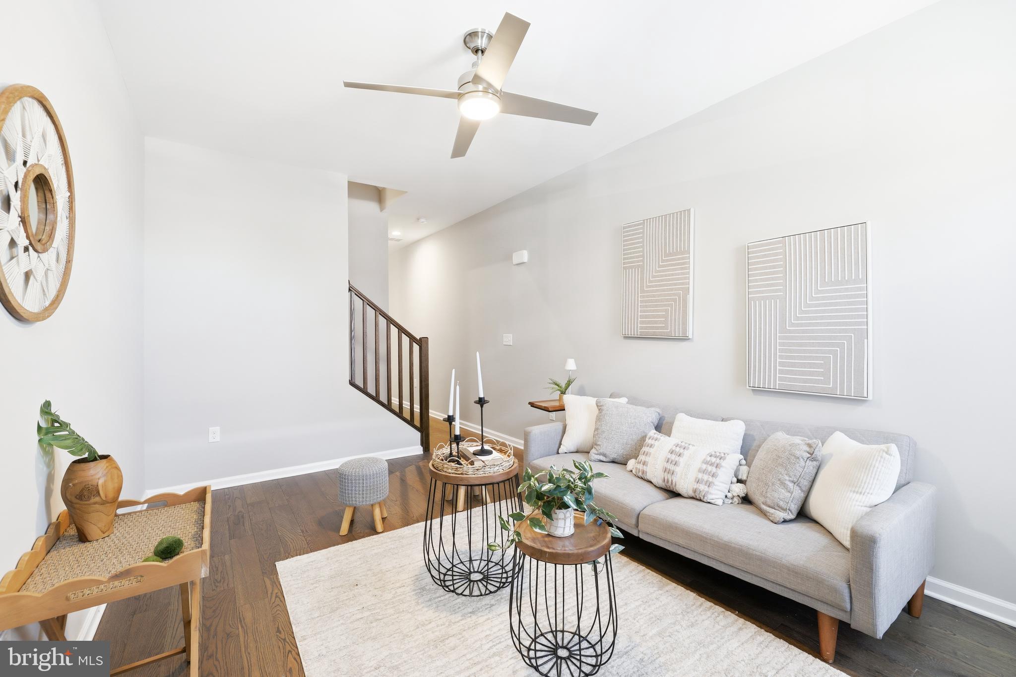703 East Preston Street Baltimore, MD 21202 - Photo 2 of 26 a living room with furniture and a wooden floor