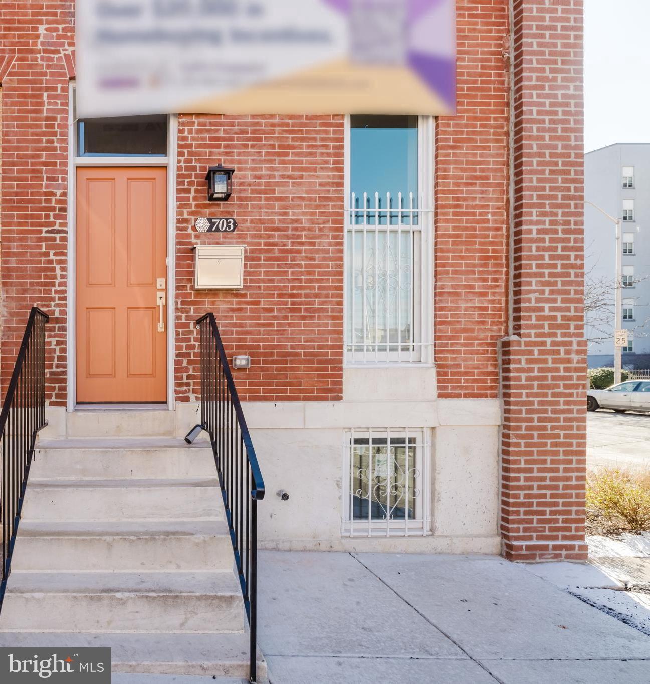 703 East Preston Street Baltimore, MD 21202 - Photo 20 of 26 a front view of a house with stairs