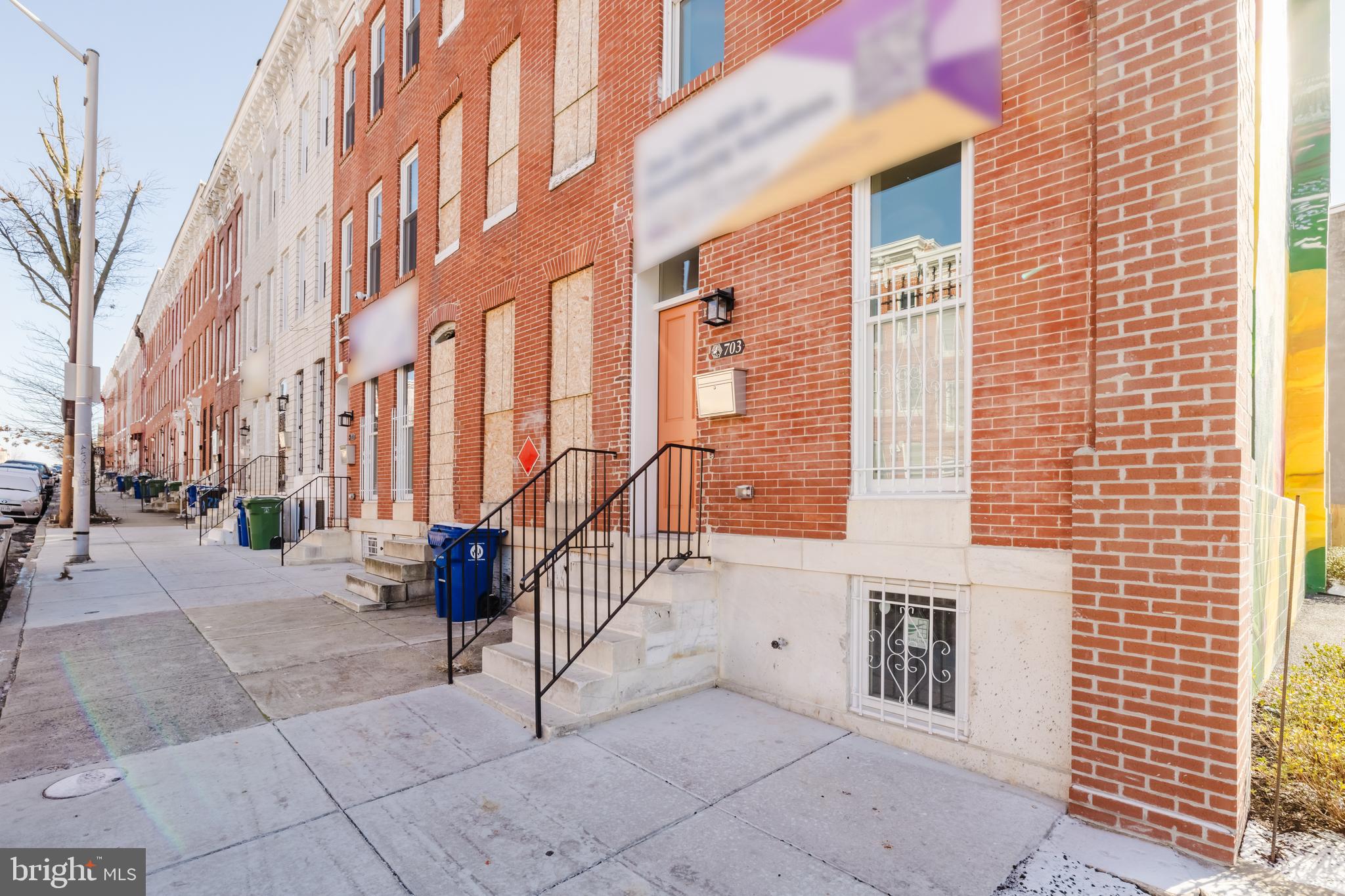 703 East Preston Street Baltimore, MD 21202 - Photo 21 of 26 a view of a building with a bench