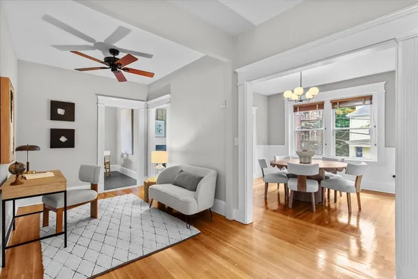 a view of a living room with wooden floor