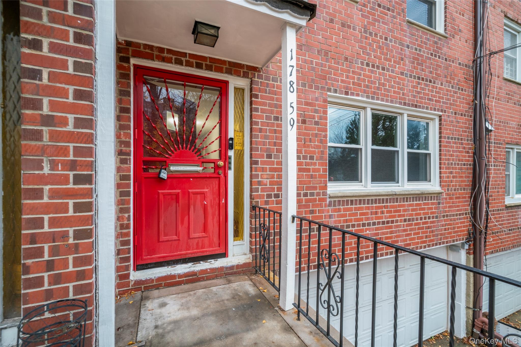 178-59 Wexford Terrace Queens, NY 11432 - Photo 2 of 45 a view of a brick building with a red door and a window