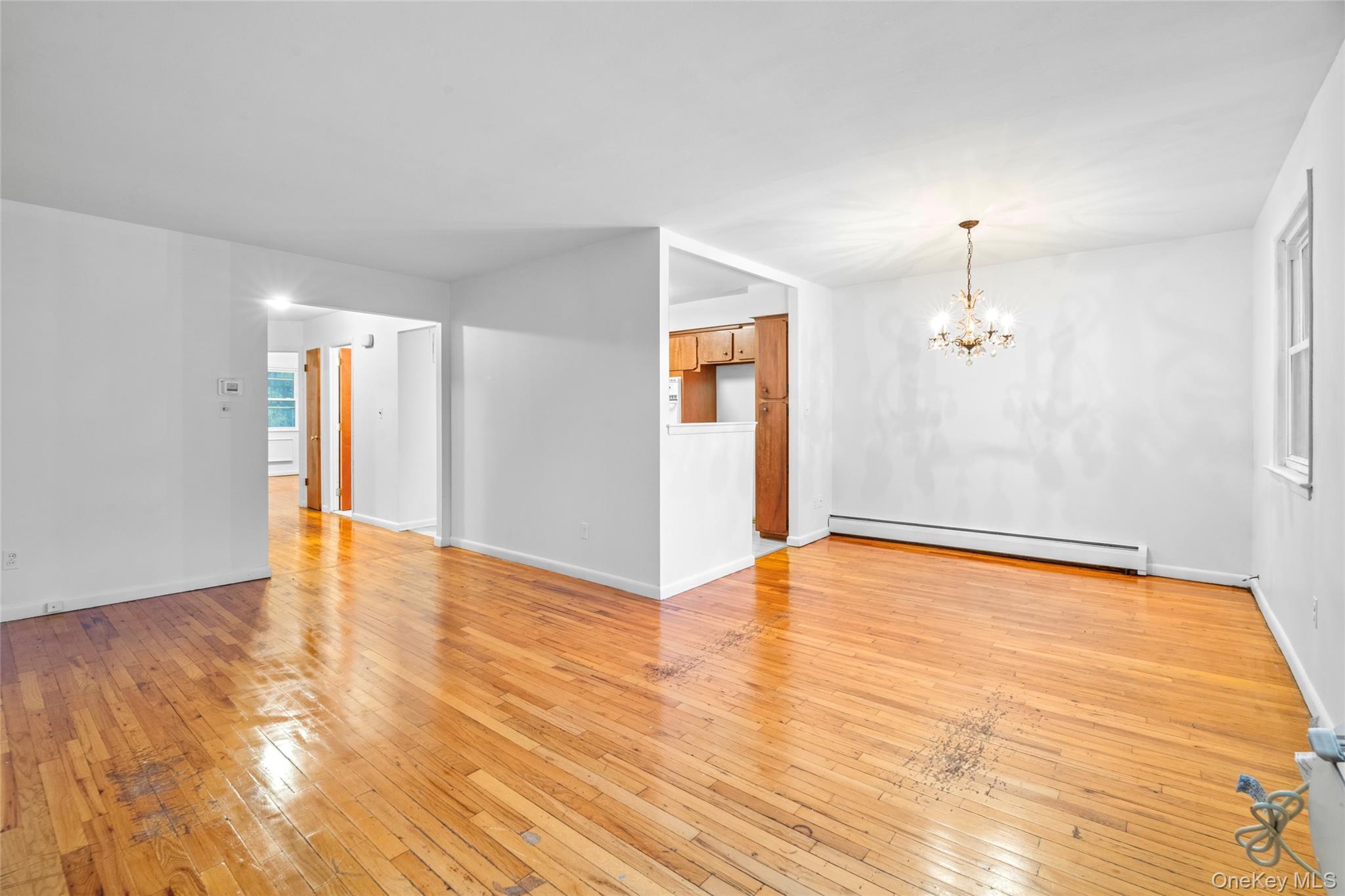 178-59 Wexford Terrace Queens, NY 11432 - Photo 26 of 45 a view of empty room with wooden floor and fan