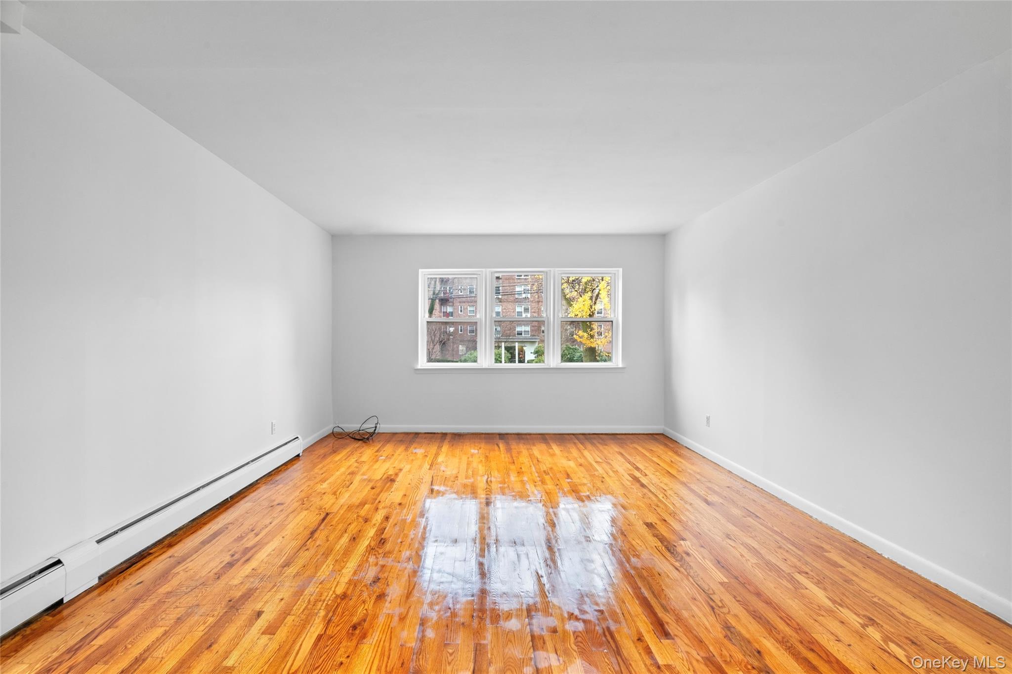 178-59 Wexford Terrace Queens, NY 11432 - Photo 5 of 45 a view of empty room with window
