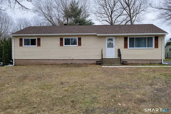 a house with yard in front of it